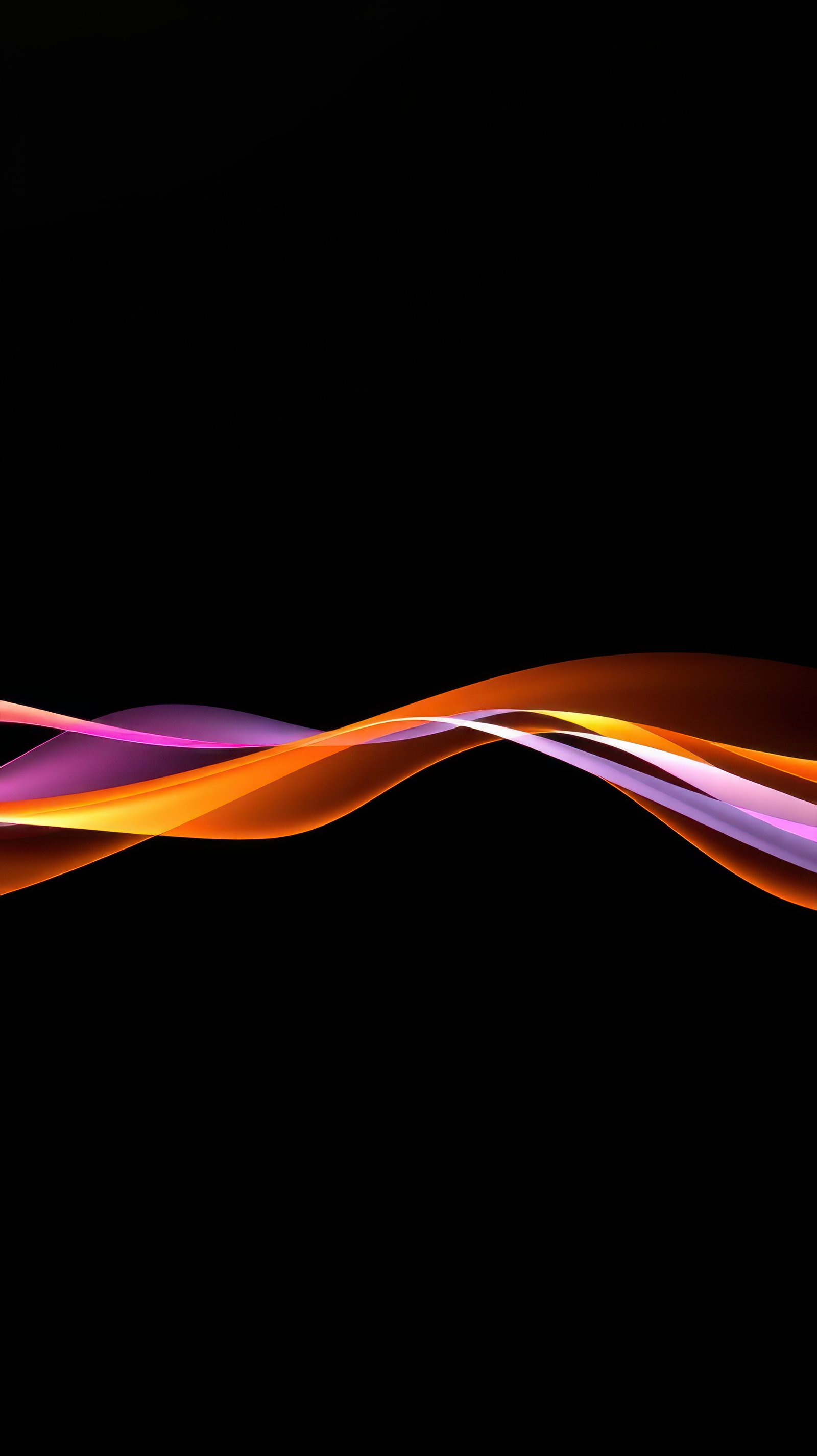 Colorful abstract waves flowing gracefully against a dark background creating a harmonious visual experience